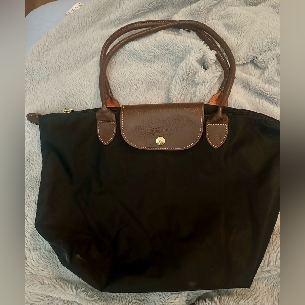 Longchamp bag small black, the handles are long not short and in good shape.